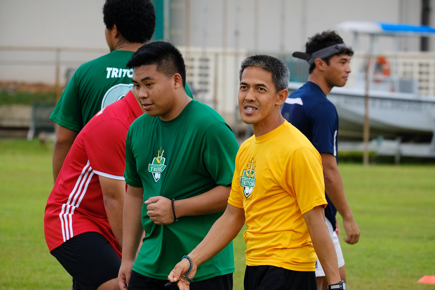 Photos - Coach Hidalgo working with team & players learning skills - Photos by UOG Sports Photographer, Victor Consaga