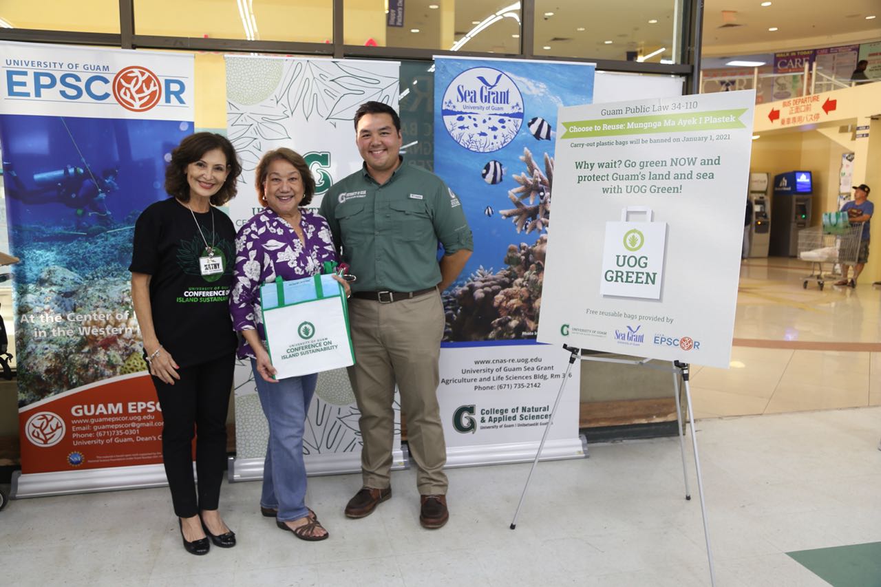 On June 7-8, the two days following the enactment of Public Law 34-110 banning plastic bags, the University of Guam Center for Island Sustainability (CIS) provided 500 free reusable bags to customers shopping at Pay-Less Supermarket in the Agana Shopping Center and Dededo. (From left to right) Kathy Sgro, Pay-Less Supermarkets Executive Vice President and former UOG Board of Regents member; Antoinette Sanford, former UOG Board of Regents Chairperson; and Austin Shelton, UOG CIS Executive Director.