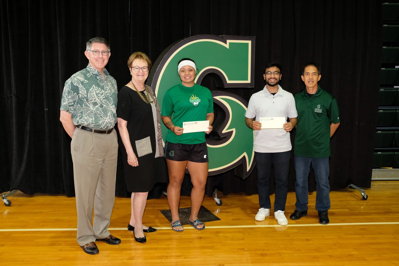 Koholai'i Maertens and Shashikant Kotwas with President Thomas Krise, Helen Whippy, and Rod Hidalgo 