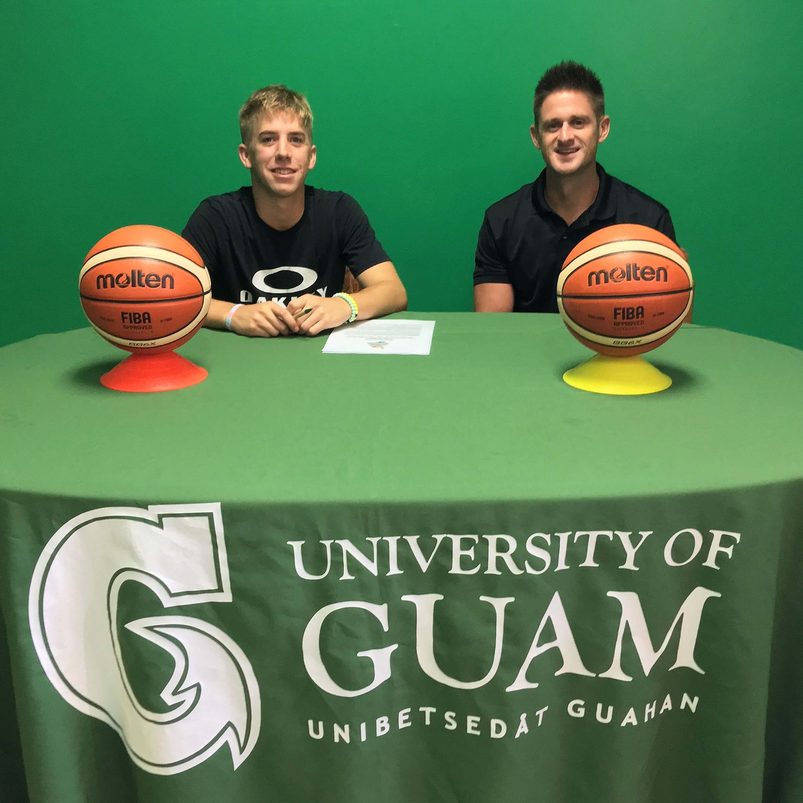 Jerod Boles with UOG Men's Basketball Coach Brent Tipton