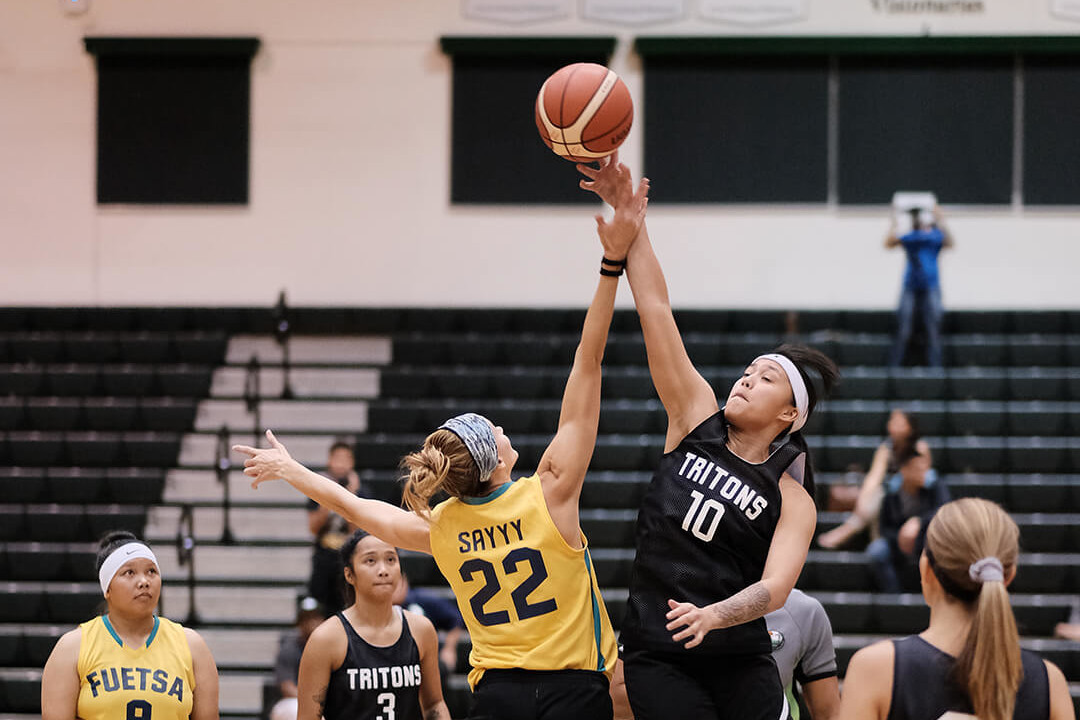 UOG Tritons player Niah Siguenza jumps to start the game against the Fuetsa Women’s Basketball Club.