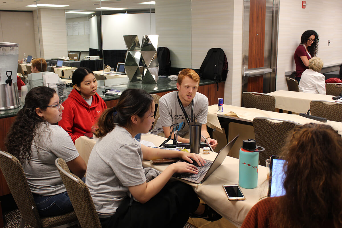 Civil engineering major Michelle Luces works with her team at the ACSC event in Chicago.