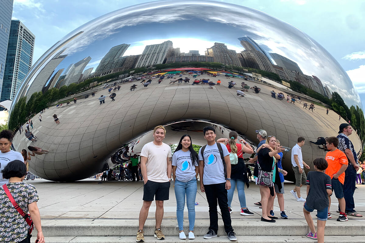 Civil engineering students Nilo Espinoza, Michelle Luces, and Ervin Pascual at “The Bean” landmark.