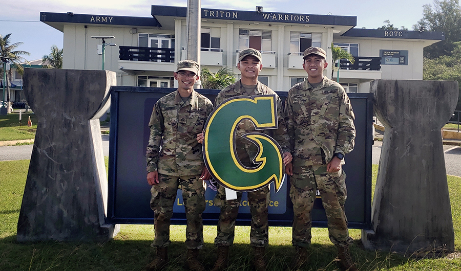 UOG ROTC cadets pose for picture in front of ROTC Building