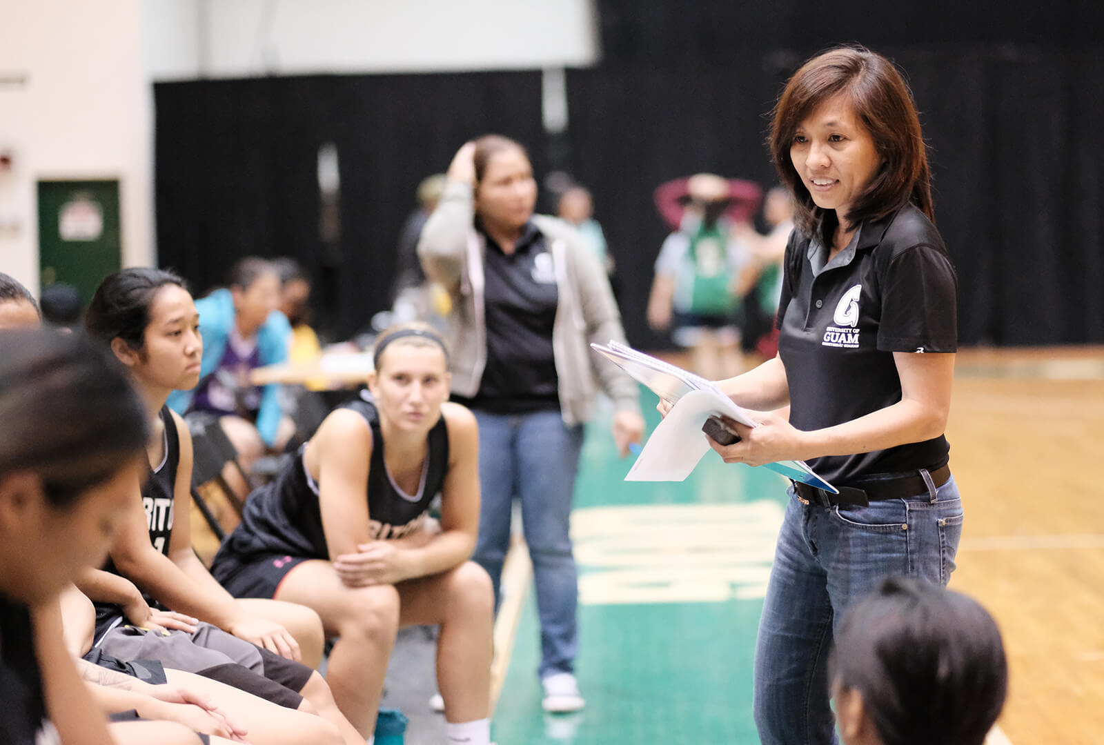 Tritons Head Coach Cecile Olandez gears the team up for the second half. 