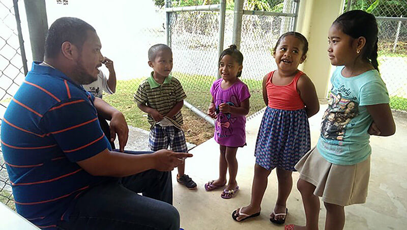 Mark Acosta with children