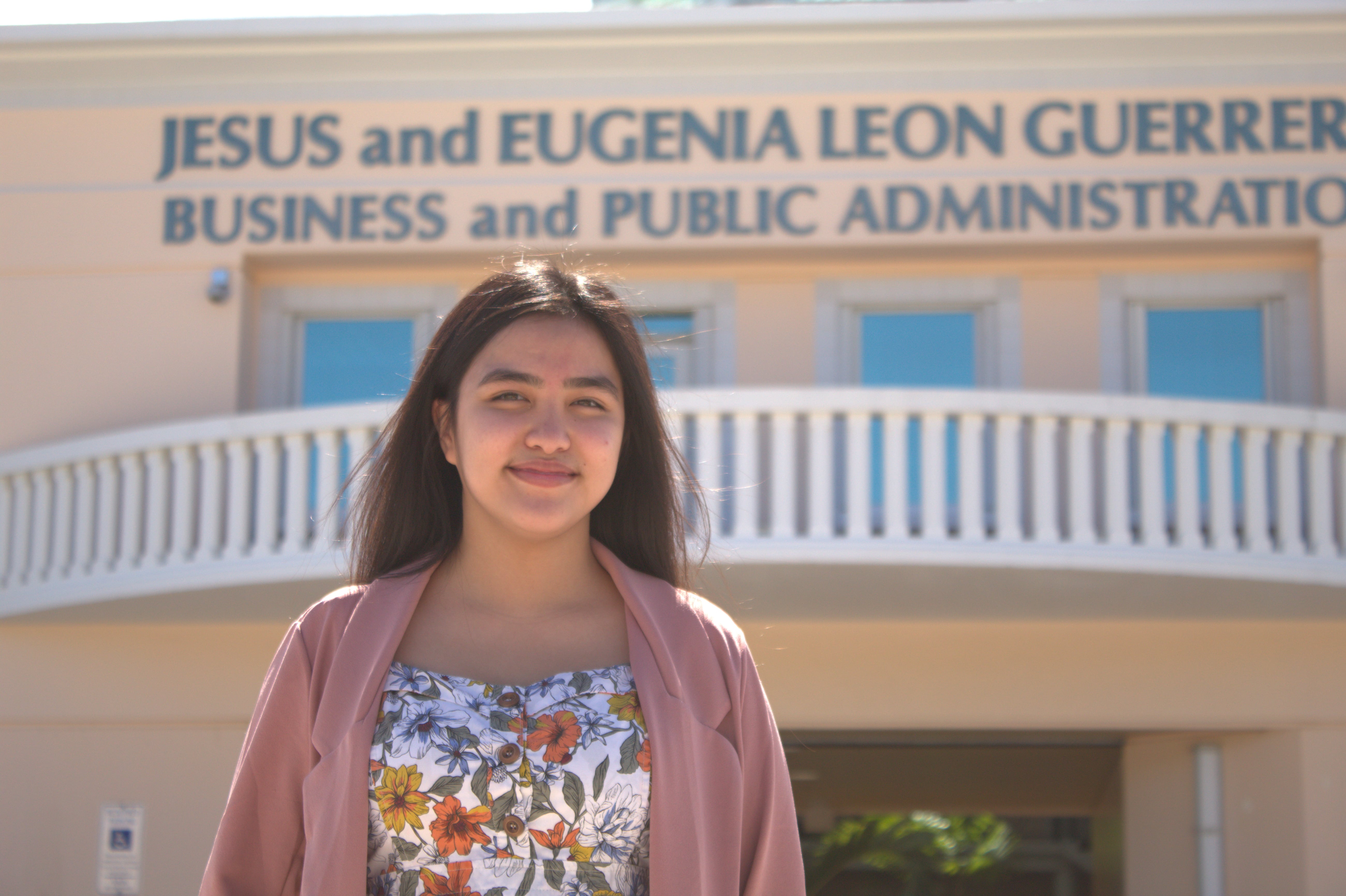 Photo of Tiera Santos in front of the SBPA building