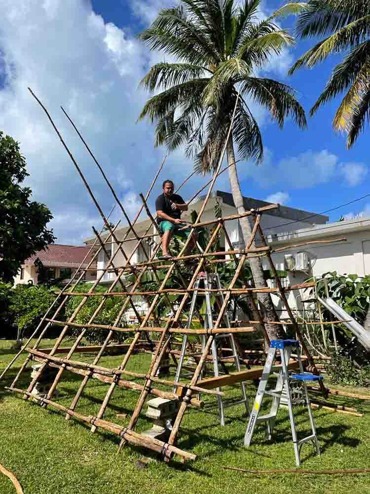 Man on carolinian canoe house frame