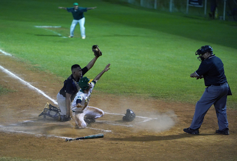 Tritons score on a close play at the plate.