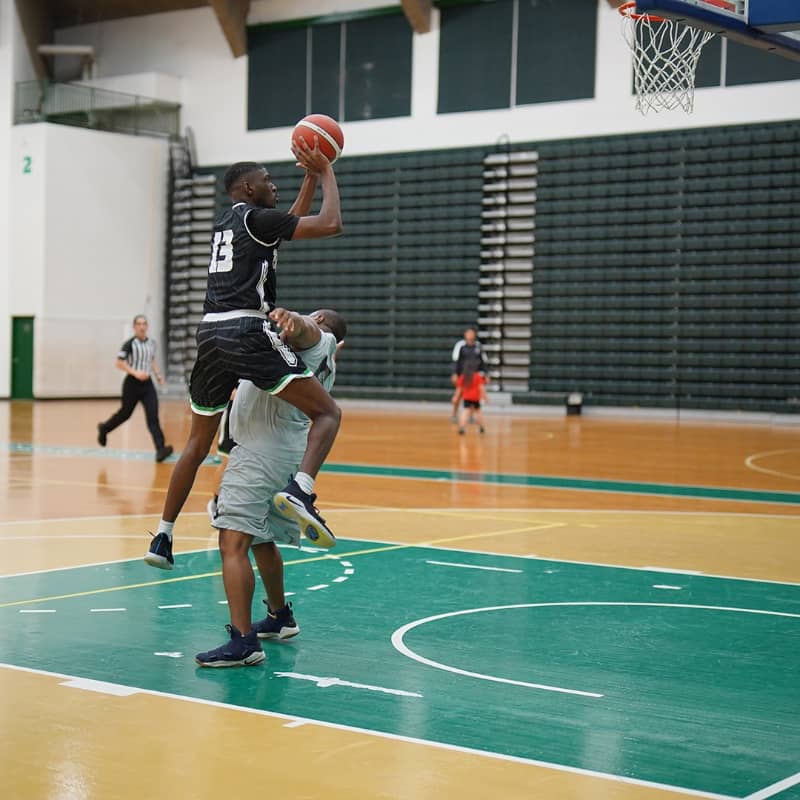 Diane’ “D” Blackmon takes a shot for the Tritons during a Triton Men’s Basketball League game