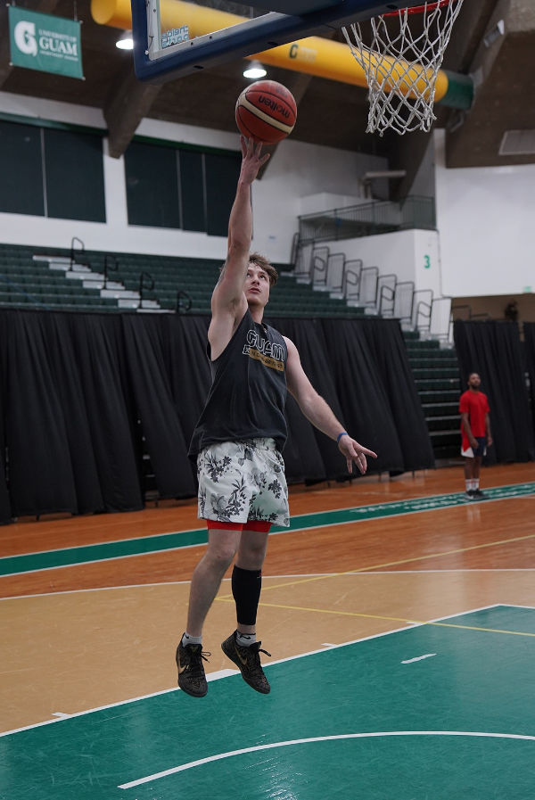 Logan Hopkins goes up for a shot at the Triton Men's Basketball Team tryouts