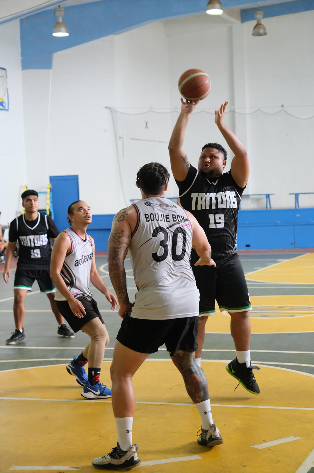 Basketball player taking a shot at a tournament