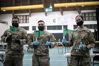 Members of the Guam National Guard at their vaccination clinic at the University of Guam Fieldhouse