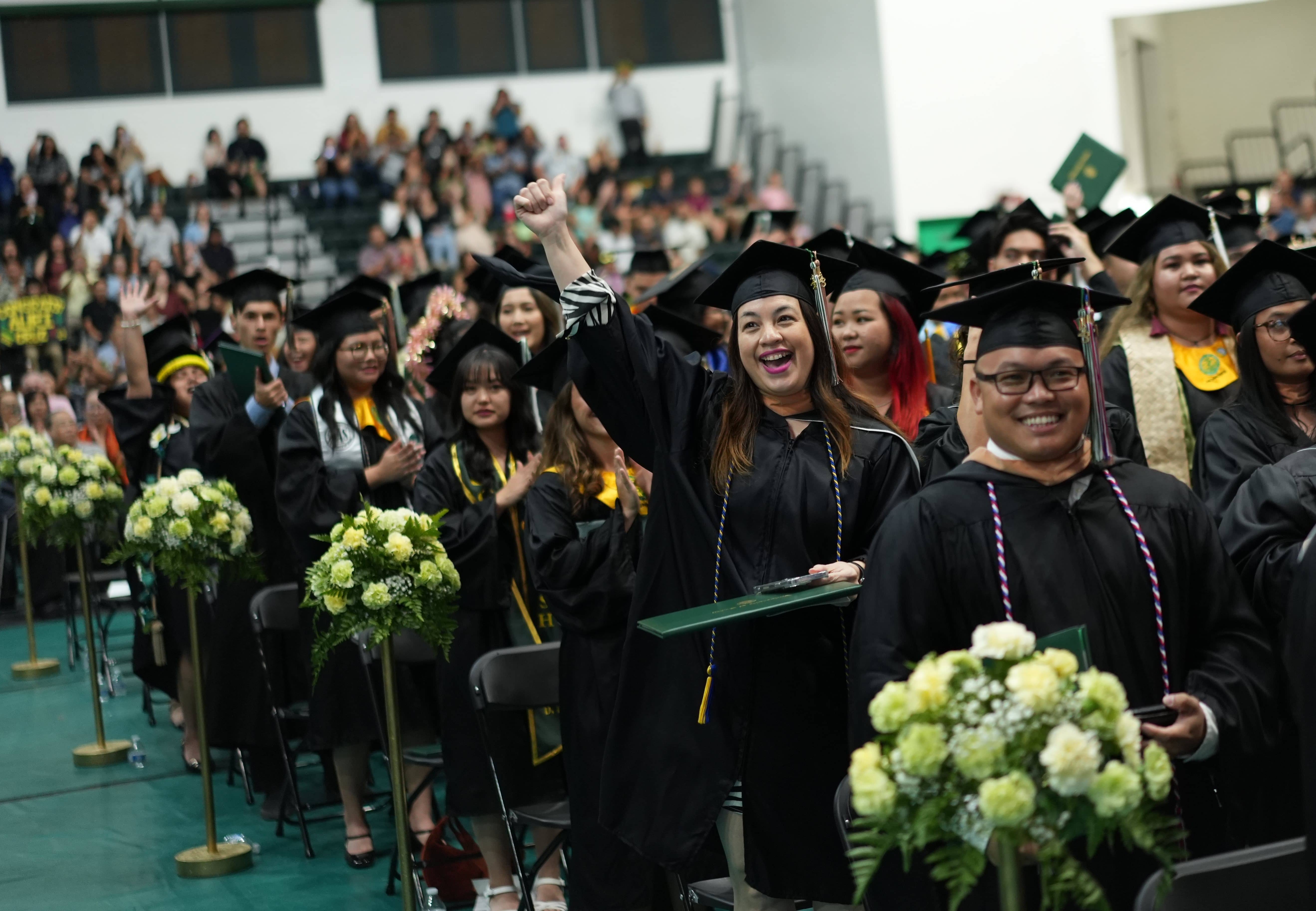 Photo of students celebrating during the Fanuchånan 2023 commencement