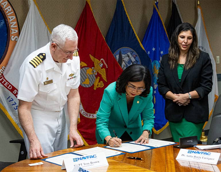 Anita Borja Enriquez and Capt. Troy Brown sign Memorandum of Understanding to formalize and internship pathway for UOG’s engineering students.