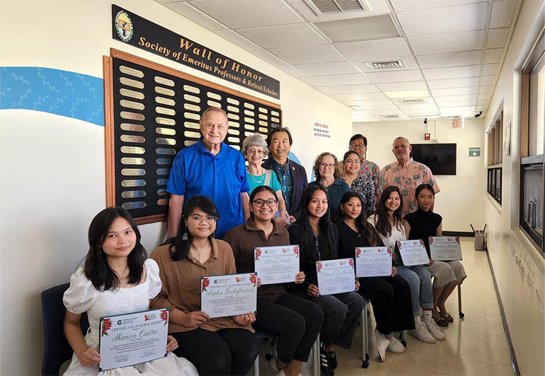 SEPRS scholarship recipients and members pose for a photo with awards