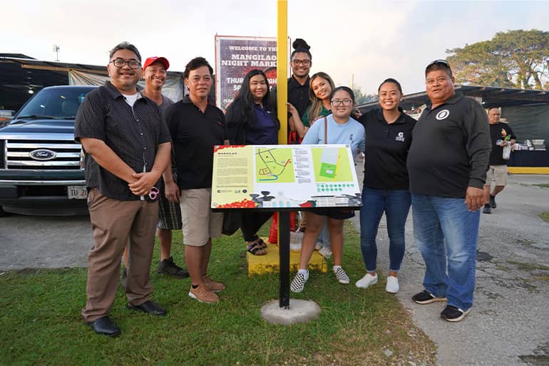 Mangilao mayor and vice mayor pose for a photo with Mangilao residents