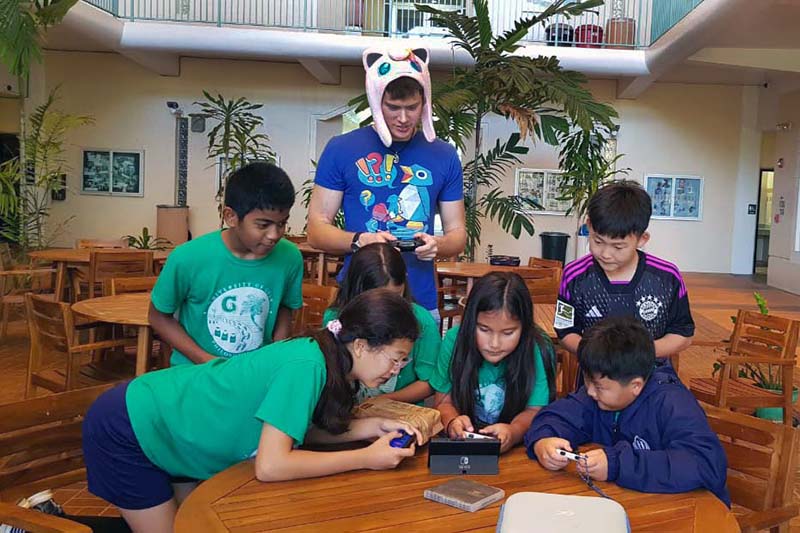 Photo of Hunter Sidell guiding kids in an activity