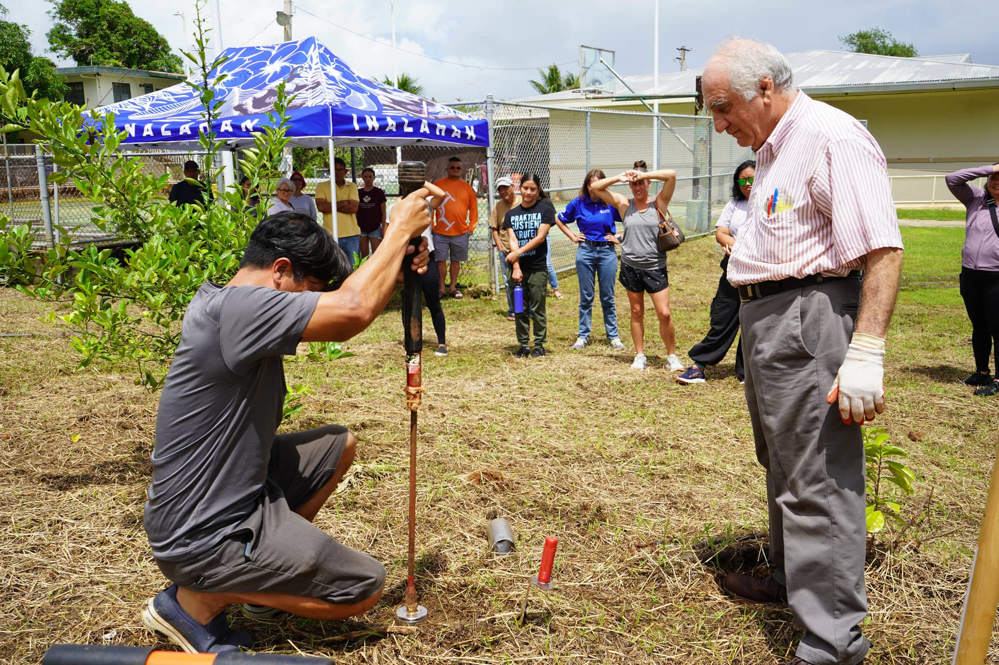 Research associate Ferdinand Galsim, left, and UOG soil scientist Dr. Mohammad Golabi