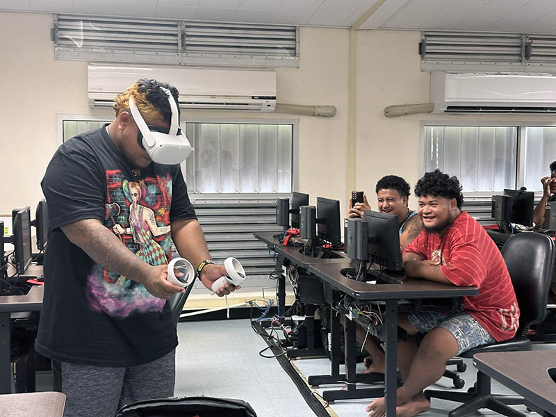 Photo of a person using a virtual reality headset in a classroom