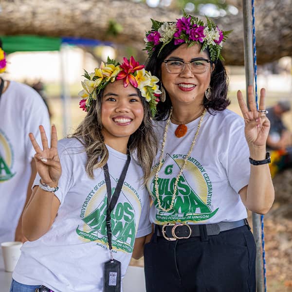 UOG President and SGA President pose for a photo at UOG center courtyard