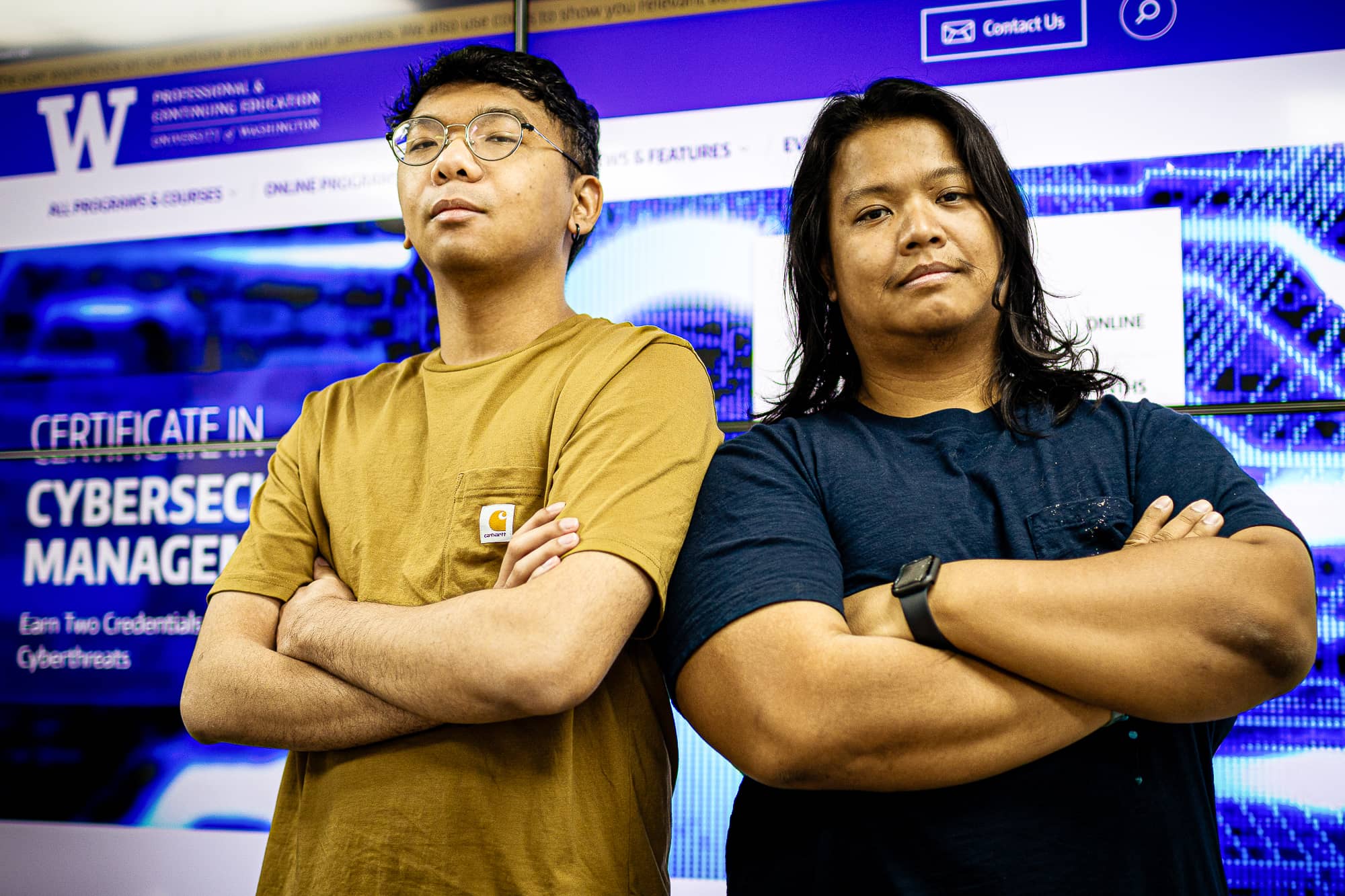 unior Information Security Analyst and Junior Network Engineer pose for photo