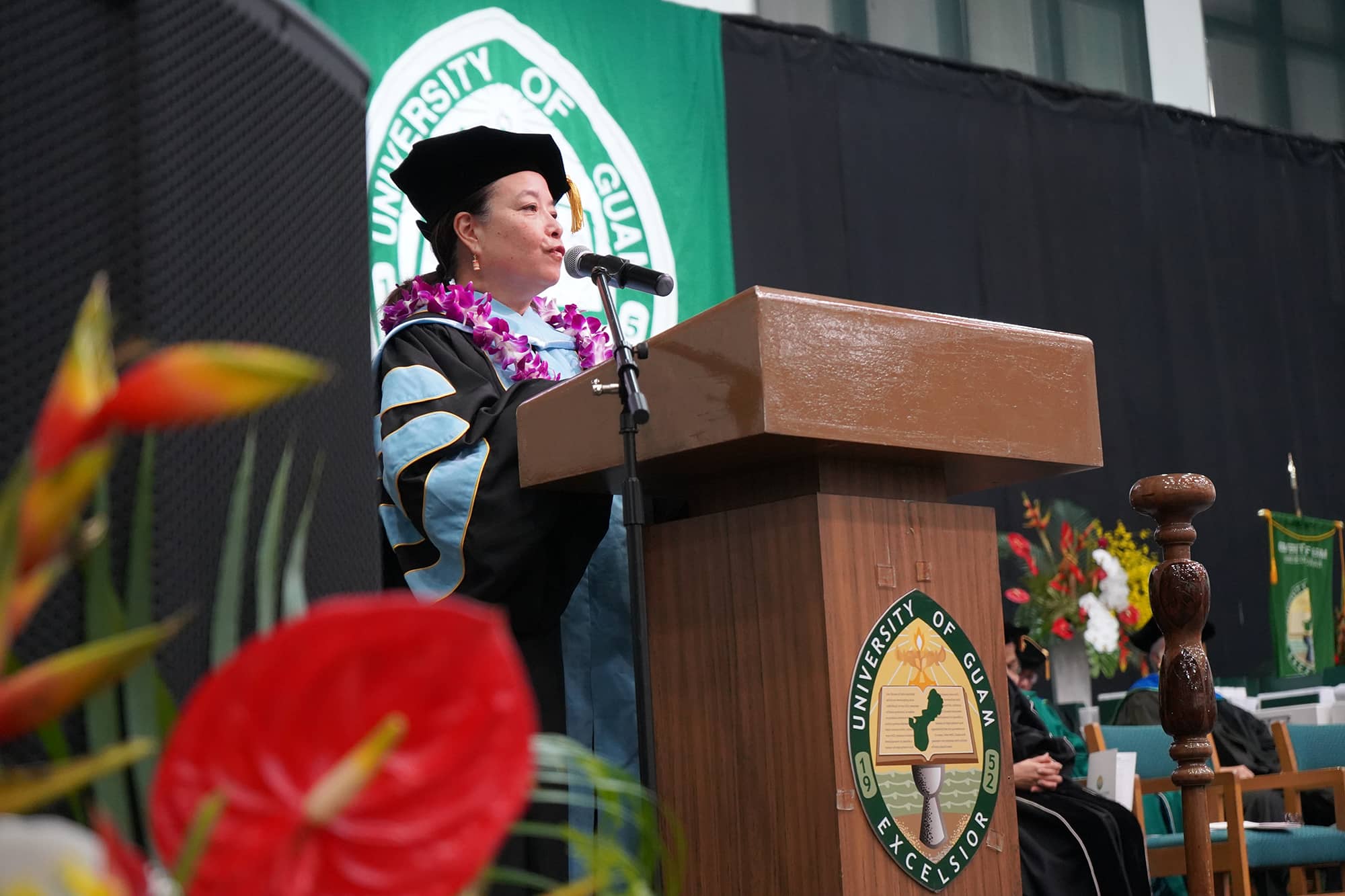 Mary Therese Perez Hattori delivers the University of Guam commencement address on May 19 at the Calvo Field House.