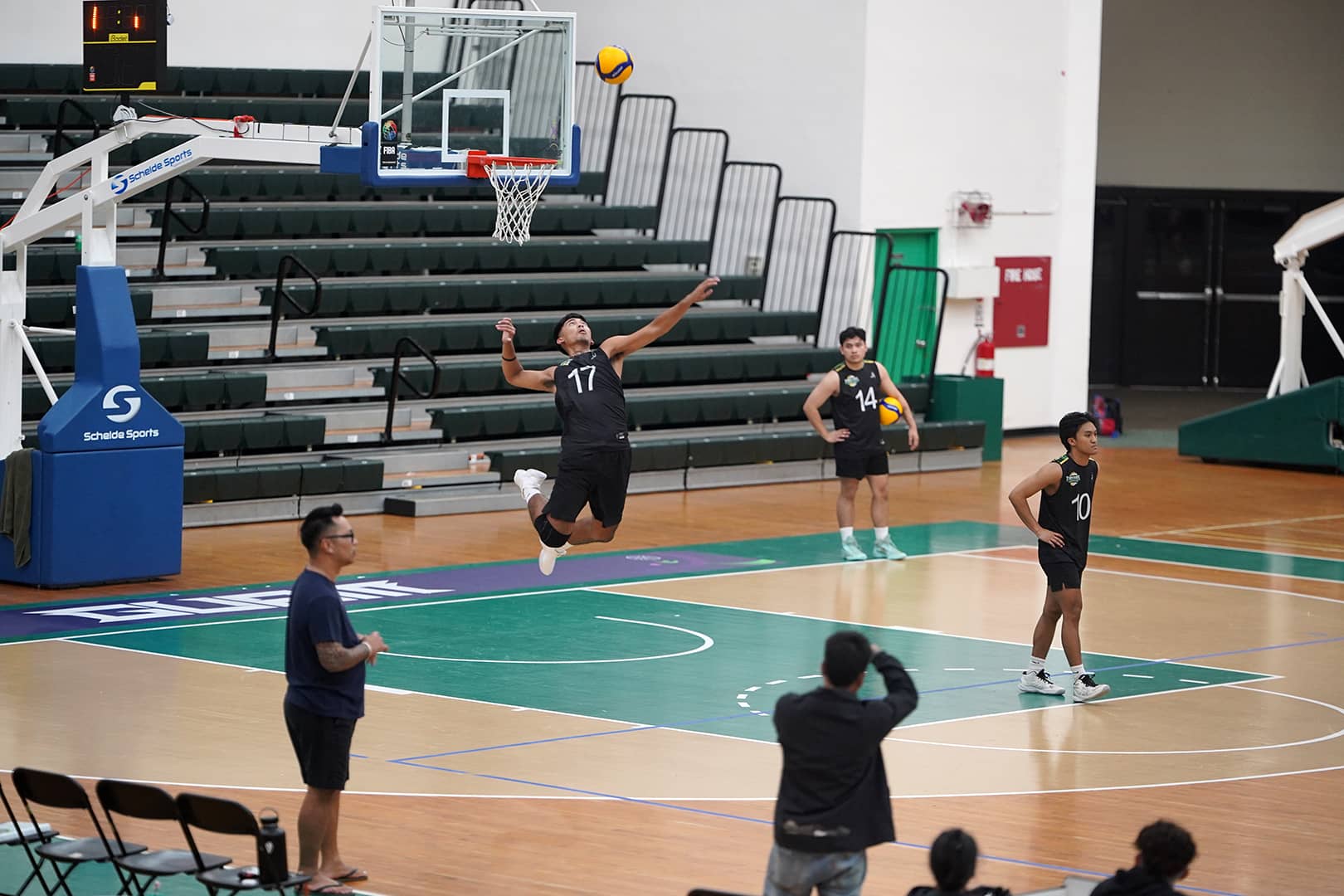 Toupe and tritons playing volleyball