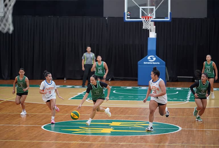 Maria Duenas dribbles ball with opponents surrounding her