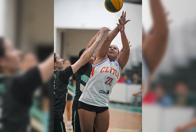 Athlete #27 in white jersey makes a shot while opposing team tries to block